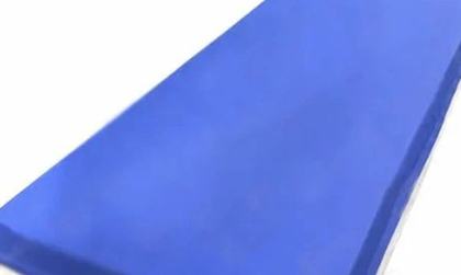 Standard navy hospital mattress, angled view